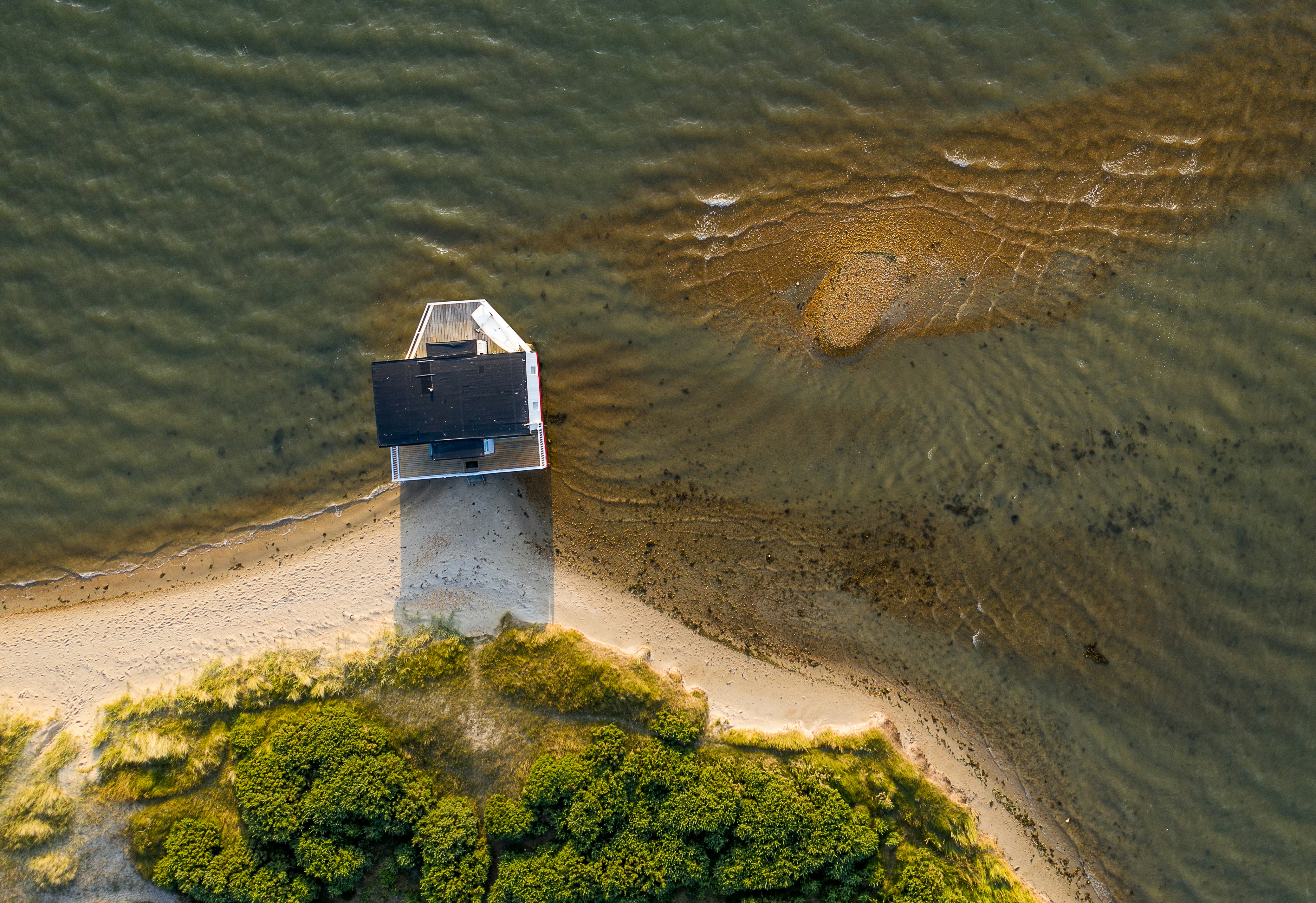 aerial photography of house on seashore